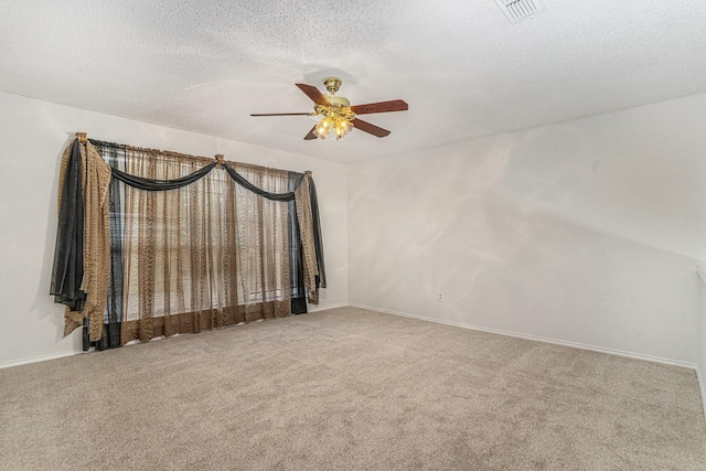 6204 Pennsylvania Ave, Arlington, TX 76017 - carpeted empty room featuring a ceiling fan and a textured ceiling