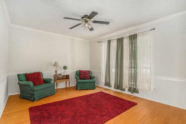 6204 Pennsylvania Ave, Arlington, TX 76017 - living area with wood finished floors, a textured ceiling, a ceiling fan, and ornamental molding