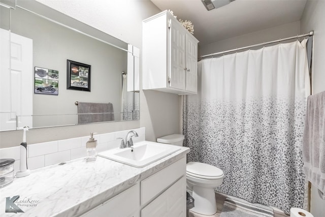 1626 Morrow Ln, Abilene, TX 79601 - full bath featuring toilet, vanity, and a shower with curtain