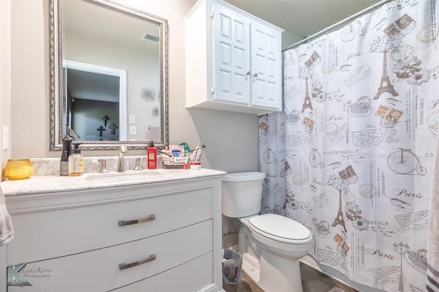 1626 Morrow Ln, Abilene, TX 79601 - bathroom with toilet, vanity, and a shower with curtain