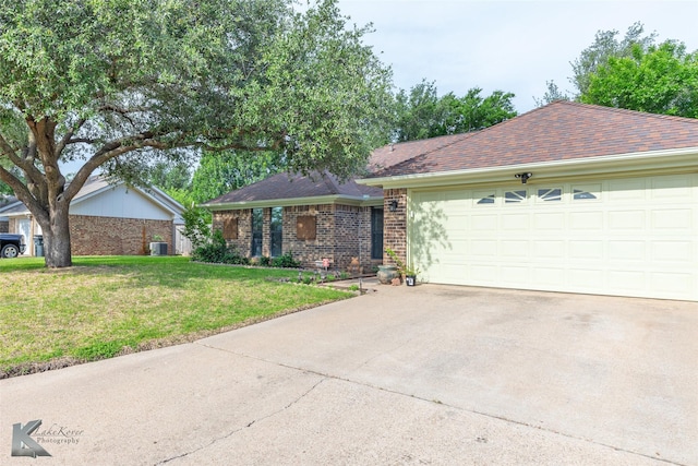 1626 Morrow Ln, Abilene, TX 79601 - single story home with a front yard, brick siding, driveway, and central AC