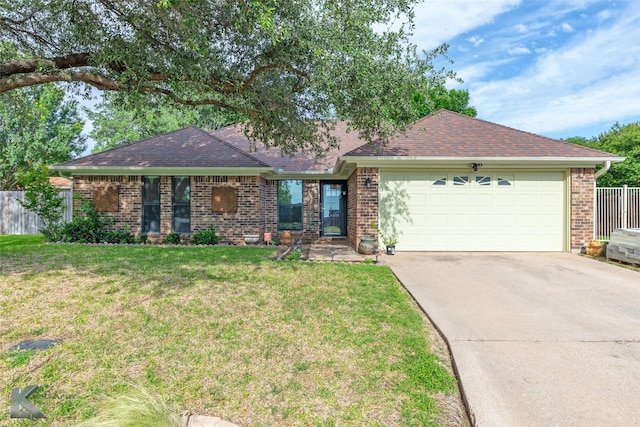 1626 Morrow Ln, Abilene, TX 79601 - single story home featuring a garage, driveway, brick siding, and roof with shingles