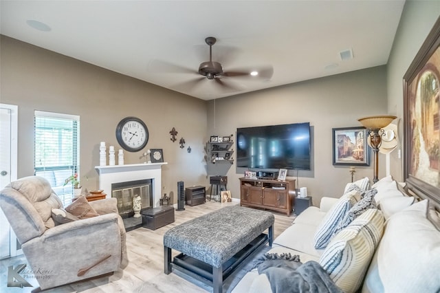 1626 Morrow Ln, Abilene, TX 79601 - living area with ceiling fan, light wood finished floors, and a glass covered fireplace
