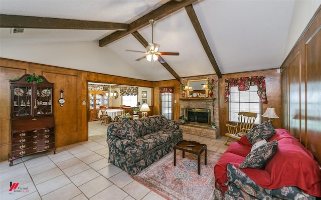 9507 Chapparral Ln, Shreveport, LA 71118 - living area with a ceiling fan, light tile patterned flooring, a brick fireplace, and wood walls