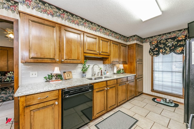 9507 Chapparral Ln, Shreveport, LA 71118 - kitchen with black appliances, a sink, a textured ceiling, brown cabinets, and backsplash