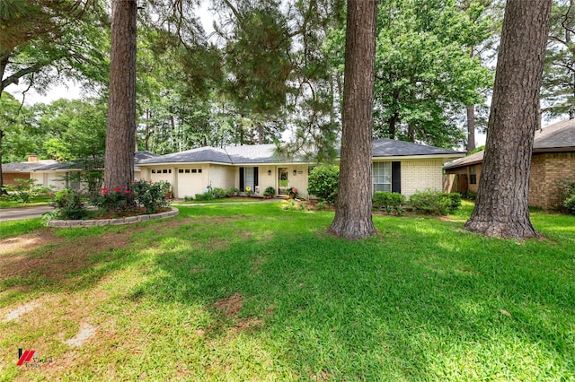 9507 Chapparral Ln, Shreveport, LA 71118 - single story home featuring an attached garage, brick siding, and a front lawn