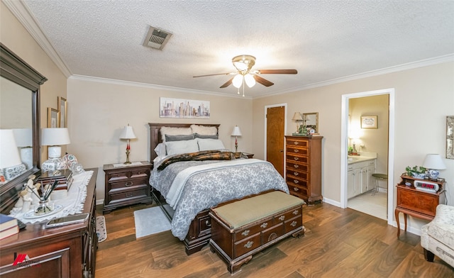 9507 Chapparral Ln, Shreveport, LA 71118 - bedroom featuring dark wood-style flooring, ornamental molding, a textured ceiling, ensuite bathroom, and a ceiling fan