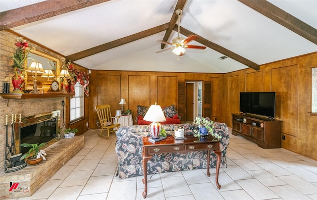 9507 Chapparral Ln, Shreveport, LA 71118 - living room featuring wood walls, light tile patterned floors, healthy amount of natural light, ceiling fan, and a fireplace
