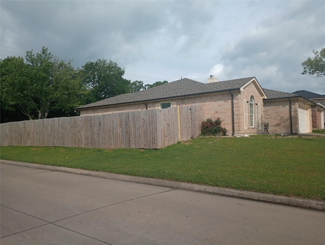 101 Jackson Dr, Terrell, TX 75160 - view of home's exterior featuring brick siding, a chimney, a garage, and a shingled roof