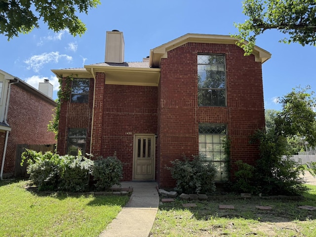 1420 Alta Mesa Ct, Mesquite, TX 75150 - view of front of house featuring brick siding, a chimney, and a front yard