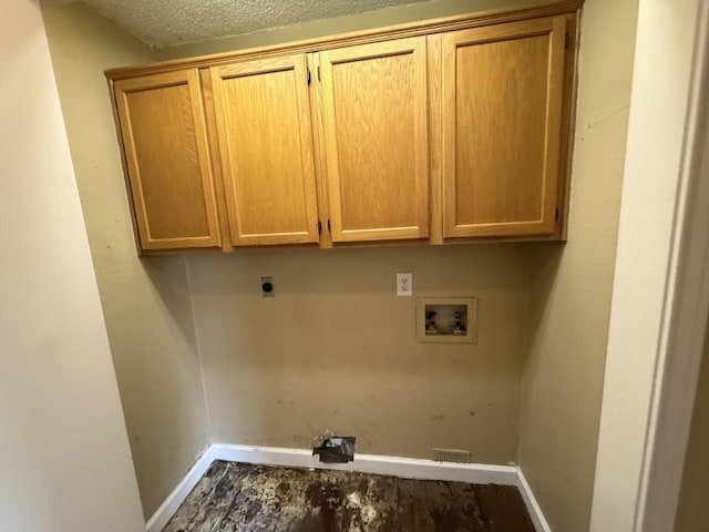 1420 Alta Mesa Ct, Mesquite, TX 75150 - washroom featuring washer hookup, cabinet space, baseboards, and hookup for an electric dryer