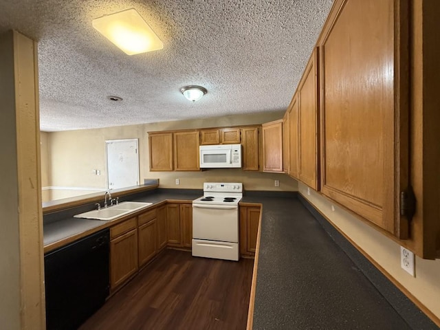 1420 Alta Mesa Ct, Mesquite, TX 75150 - kitchen with white appliances, a sink, dark wood-style flooring, a textured ceiling, and brown cabinetry