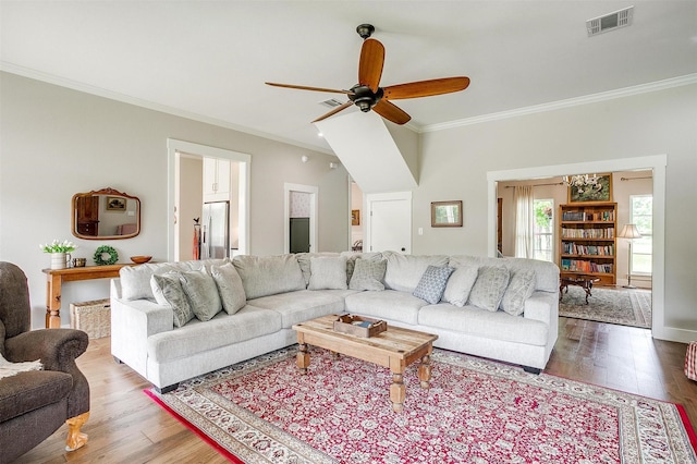 182 Hcr 1431, Covington, TX 76636 - living area featuring ornamental molding, wood finished floors, and ceiling fan
