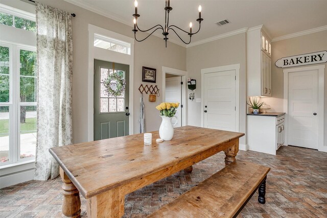 182 Hcr 1431, Covington, TX 76636 - dining space with brick floors, crown molding, a chandelier, and healthy amount of natural light