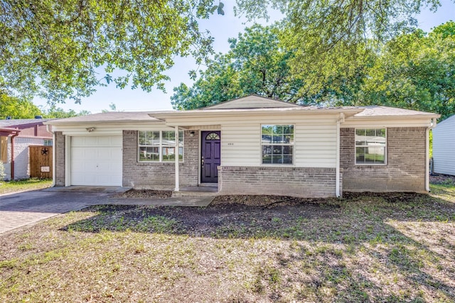 4312 Ridgedale Dr, Mesquite, TX 75150 - single story home featuring a garage, brick siding, and decorative driveway