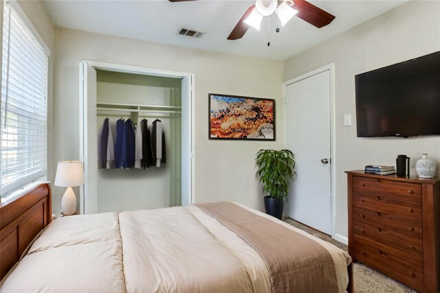 4312 Ridgedale Dr, Mesquite, TX 75150 - bedroom with a closet, multiple windows, light colored carpet, and a ceiling fan