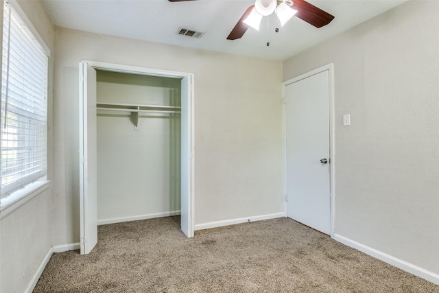 4312 Ridgedale Dr, Mesquite, TX 75150 - unfurnished bedroom with carpet floors, a closet, baseboards, and a ceiling fan