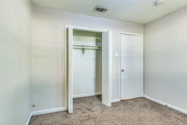 4312 Ridgedale Dr, Mesquite, TX 75150 - unfurnished bedroom featuring carpet floors, a closet, and baseboards