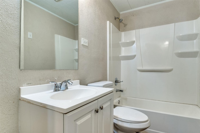 4312 Ridgedale Dr, Mesquite, TX 75150 - bathroom featuring a textured wall, toilet, vanity, and bathing tub / shower combination