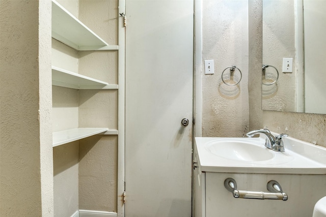 4312 Ridgedale Dr, Mesquite, TX 75150 - bathroom featuring a textured wall and vanity
