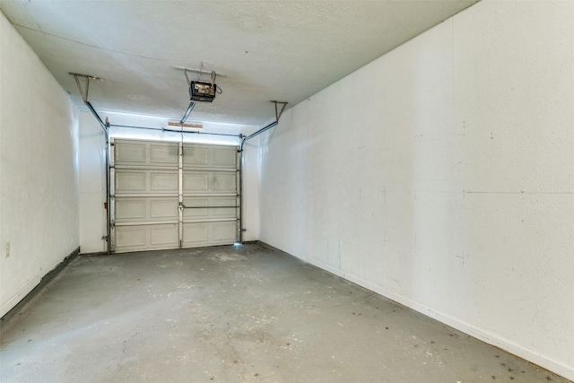 4312 Ridgedale Dr, Mesquite, TX 75150 - garage with a garage door opener and baseboards