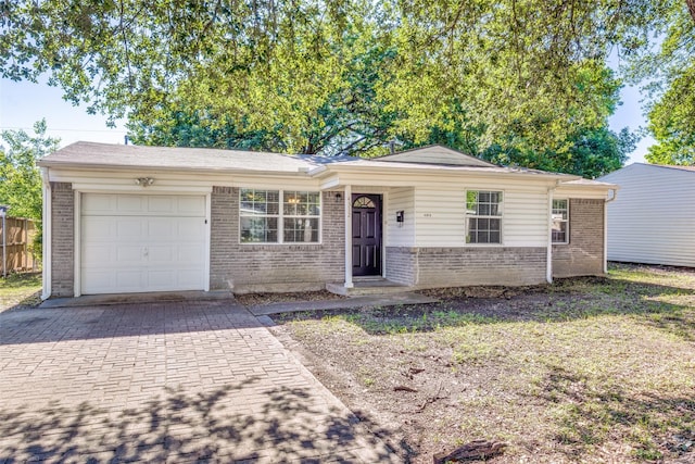 4312 Ridgedale Dr, Mesquite, TX 75150 - ranch-style home featuring brick siding, an attached garage, and decorative driveway
