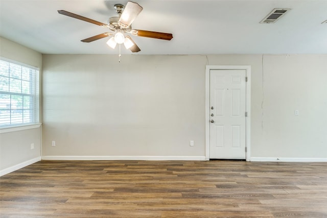 4312 Ridgedale Dr, Mesquite, TX 75150 - spare room with wood finished floors, a ceiling fan, and baseboards