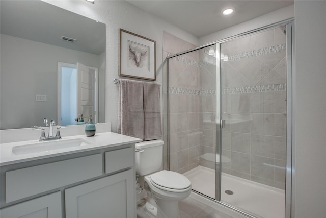 306 Ridge Dr, Justin, TX 76247 - bathroom with a shower stall, toilet, vanity, tile patterned floors, and recessed lighting