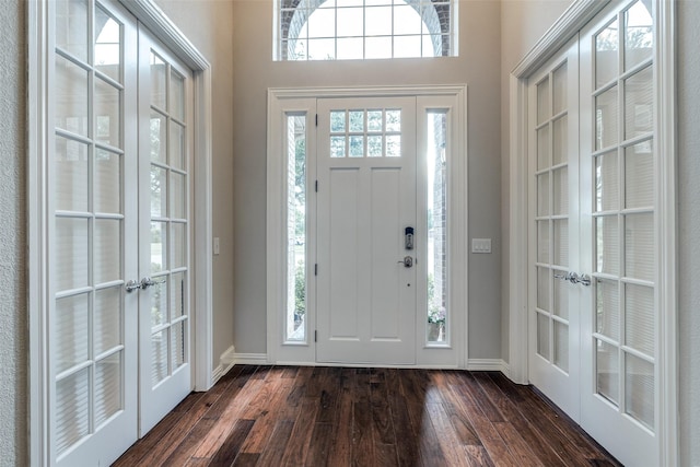 5924 Deerwood Ln, Frisco, TX 75036 - foyer with french doors, dark wood finished floors, and baseboards