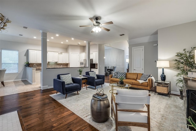 5924 Deerwood Ln, Frisco, TX 75036 - living room with wood finished floors, ceiling fan, decorative columns, baseboards, and recessed lighting