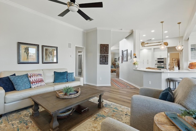 3921 Overlake Dr, Plano, TX 75023 - living room featuring a ceiling fan, baseboards, crown molding, wood finished floors, and recessed lighting