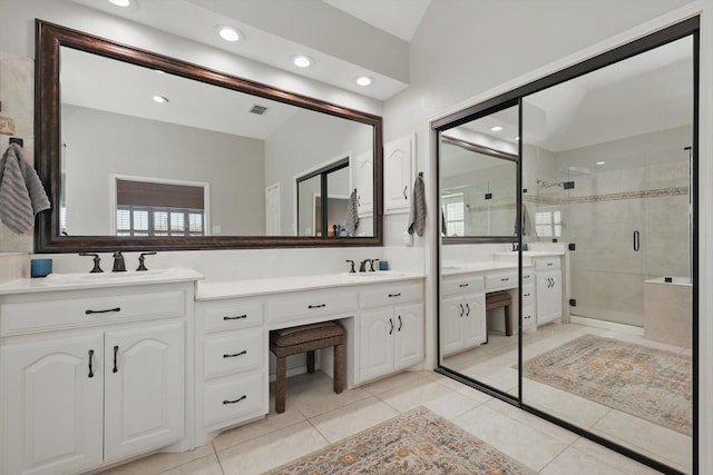3921 Overlake Dr, Plano, TX 75023 - bathroom featuring a shower stall, double vanity, tile patterned flooring, and recessed lighting