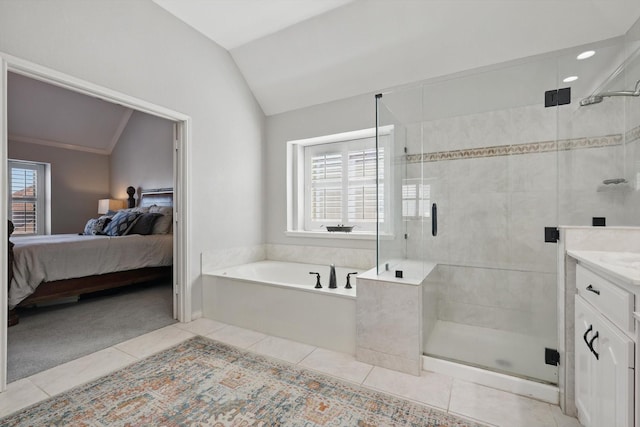3921 Overlake Dr, Plano, TX 75023 - ensuite bathroom with lofted ceiling, tile patterned flooring, a garden tub, a shower stall, and vanity