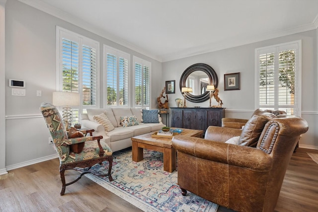 3921 Overlake Dr, Plano, TX 75023 - living area with crown molding, healthy amount of natural light, wood finished floors, and baseboards