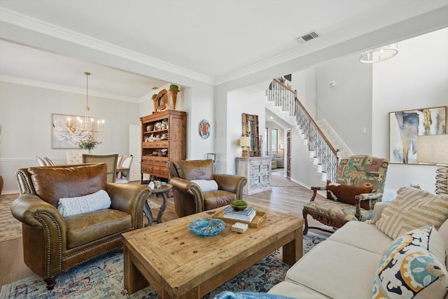 3921 Overlake Dr, Plano, TX 75023 - living room featuring a chandelier, wood finished floors, ornamental molding, stairs, and baseboards