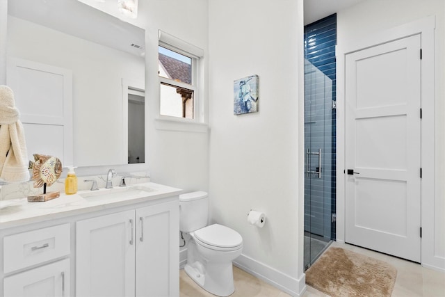 1206 Whisper Rock Dr, Rockwall, TX 75032 - bathroom featuring toilet, vanity, a stall shower, tile patterned flooring, and baseboards