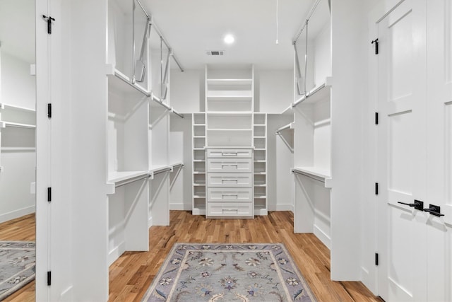 1206 Whisper Rock Dr, Rockwall, TX 75032 - walk in closet featuring light wood-type flooring