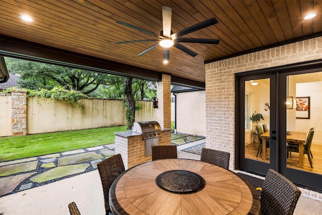 1206 Whisper Rock Dr, Rockwall, TX 75032 - view of patio / terrace featuring area for grilling, a grill, outdoor dining space, fence, and a ceiling fan