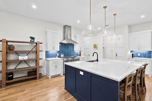 1206 Whisper Rock Dr, Rockwall, TX 75032 - kitchen featuring wall chimney exhaust hood, stainless steel range, a sink, decorative backsplash, and recessed lighting