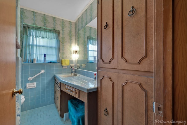 3315 Surrey Rd, Shreveport, LA 71105 - bathroom featuring wallpapered walls, plenty of natural light, tile patterned floors, tile walls, and vanity