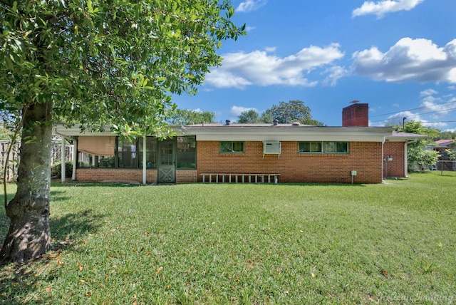 3315 Surrey Rd, Shreveport, LA 71105 - back of property featuring brick siding, a chimney, a yard, and a sunroom