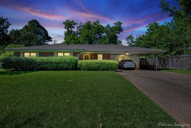 3315 Surrey Rd, Shreveport, LA 71105 - ranch-style house featuring concrete driveway, an attached carport, and brick siding