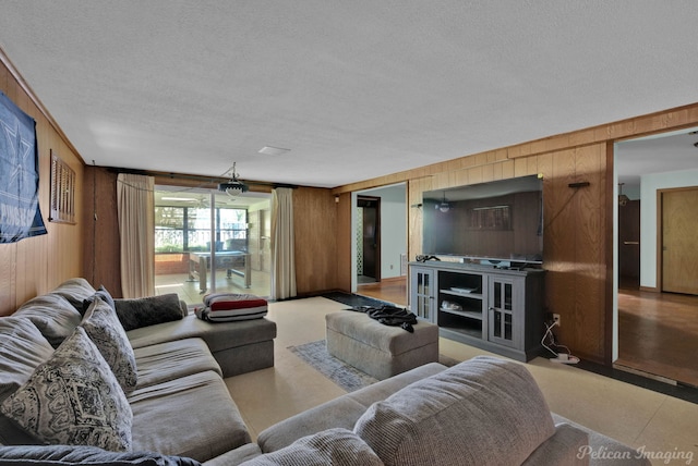 3315 Surrey Rd, Shreveport, LA 71105 - living area with wood walls and a textured ceiling