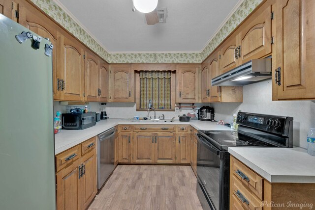 3315 Surrey Rd, Shreveport, LA 71105 - kitchen featuring black appliances, under cabinet range hood, a sink, light wood-style floors, and ornamental molding