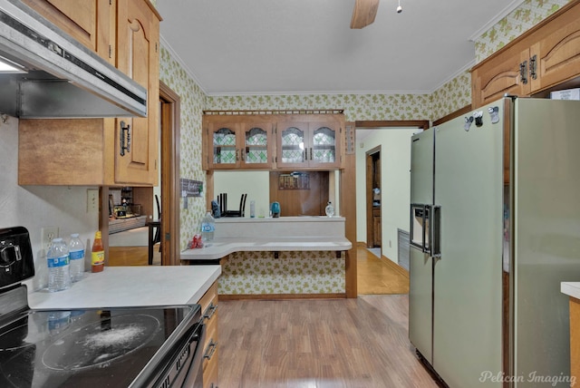 3315 Surrey Rd, Shreveport, LA 71105 - kitchen with white fridge with ice dispenser, electric range, under cabinet range hood, wallpapered walls, and ornamental molding