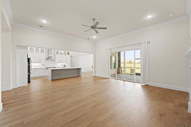 2101 Narrow Rd, Lucas, TX 75002 - unfurnished living room with ceiling fan, light wood finished floors, baseboards, crown molding, and a sink