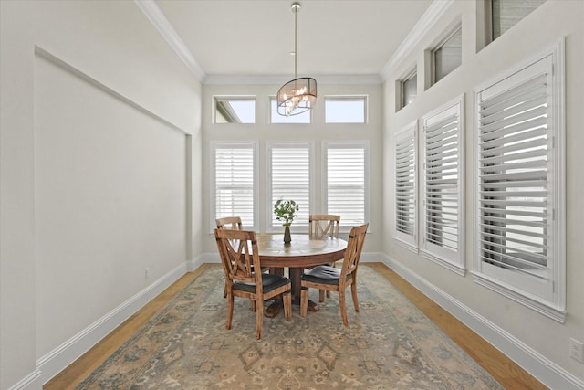 2101 Narrow Rd, Lucas, TX 75002 - dining space with ornamental molding, a chandelier, baseboards, and wood finished floors
