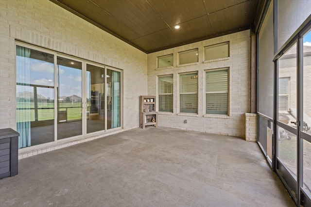 2101 Narrow Rd, Lucas, TX 75002 - unfurnished sunroom featuring wooden ceiling, brick wall, and carpet floors