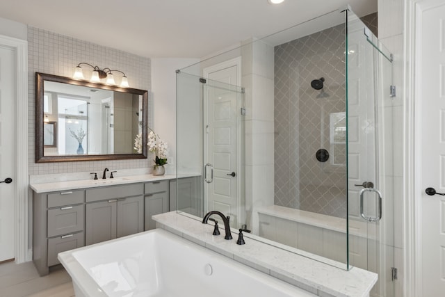 1609 Colonnade Ct, Mckinney, TX 75069 - full bath with a shower stall, decorative backsplash, a bath, and vanity