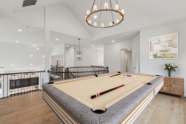 1609 Colonnade Ct, Mckinney, TX 75069 - recreation room with a chandelier, light wood-style floors, high vaulted ceiling, recessed lighting, and billiards